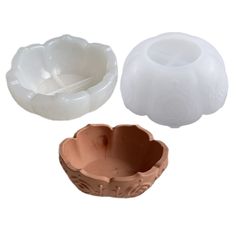 three different types of plastic bowls on a white background, one is brown and the other is white