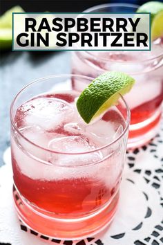 raspberry gin spritzer in glasses with lime garnish on the rim