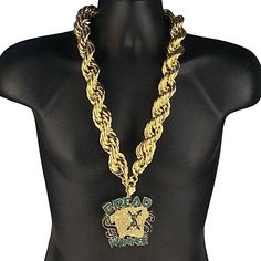 Mens hollow rope chain hip hop necklace. 14k gold plated plated over a brass core. Huge chain has nice weight at 425 grams. Chain is 30 inches long x 30 mm wide. Stylish and secure spring ring clasp. "Bread Winner" big charm hip hop pendant. Huge pendant is approx 3.5" tall x 3.5" wide. High quality gold finish over alloy metal. Micro pave green, black, clear stones. Heavy Hip hop pendant weighs 149 grams. Full flooded bling pendant shines super hard. High quality piece looks like a million buck Bread Winners, Big Pendant, Hip Hop Chains, Hip Hop Necklace, Clear Stone, Hip Hop Jewelry, Micro Pave, Rope Chain, Spring Rings