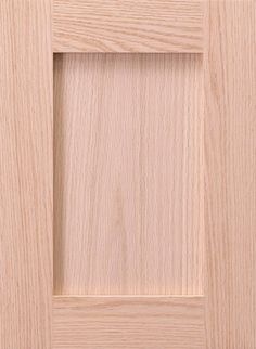 an unfinished wooden door with a square opening