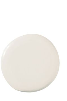 an empty white plate on a white background