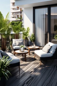 an outdoor living area with couches, tables and potted plants on the deck