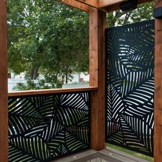 an outdoor privacy screen with leaves on it