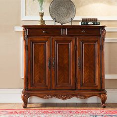 a wooden cabinet sitting on top of a rug