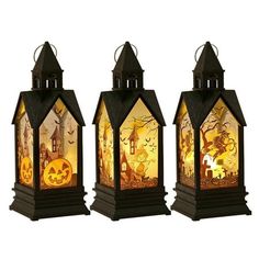 three halloween lanterns with pumpkins on them