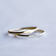 A 14k Gold Filled, Rose Gold Filled or Sterling Silver Dainty Tiny Signet Ring, customised with a letter/initial of your choosing. The perfect ring for stacking! ♥ Available in sizes 3 US to 16 US.Unsure of size? Purchase our ring size here : https://stampandshineau.etsy.com/listing/1461050013 ♥ Ring band thickness is 1.2mm ♥ Capital (Uppercase) letter only ♥ Completely handmade for you from Melbourne, Australia ♥ Made entirely from precious metals - gold filled / sterling silver  (Gold filled has 100x more gold pressure bonded to its surface than "gold plated", so your rings will last and is safe to wear in the shower) ♥ Due to the handmade nature of this item, there will be some slight colour variances where the solder seam is  Please note : Each piece is handmade & no two rings are ever Gold With Silver Rings, Initial Wedding Ring, Dainty Initial Ring, Cute Couple Jewelry, Ring With Initials, Alphabet Ring, Customised Jewellery, Stamp Ring, Silver Initial Ring