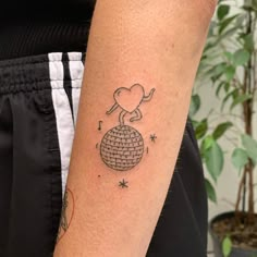 a person with a small tattoo on their arm