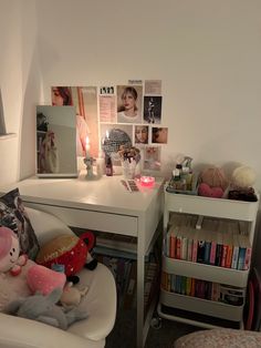 a room with a desk, chair and bookshelf filled with stuff animals on it