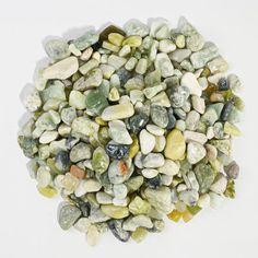 a pile of green and white rocks sitting on top of each other