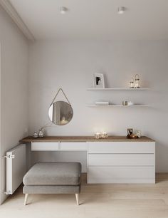 a white room with a bench, mirror and shelves on the wall next to it