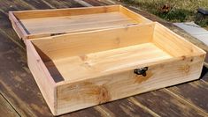 a wooden box sitting on top of a wooden table