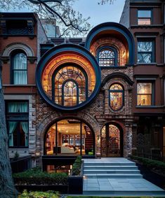 a large brick building with arched windows and steps leading up to the front door area