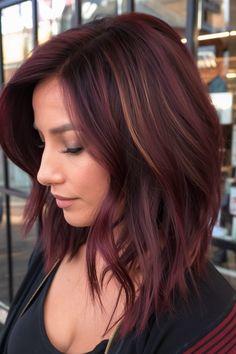 This burgundy lob (long bob) is a striking option for those looking for January hair color ideas brunettes. The vibrant burgundy shade is accented with dimensional highlights that create depth and movement, perfect for anyone wanting a bold yet sophisticated style. Light Burgundy Hair, Burgundy Blonde Hair, Burgundy Hair With Highlights, Short Burgundy Hair, Burgandy Hair, Balayage Hair Blonde Medium, Medium Shag Hairstyles, Burgundy Hair Color, Red Hair With Highlights