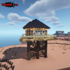 a small building with a sign that says water on it's roof in the middle of a desert