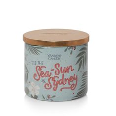 yankee candle tea - sun and sydney tin candle in blue with floral design on the lid