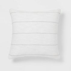 a white striped pillow on a white background