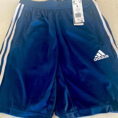 Mens Adidas Shorts. Navy, Size Small, Nwt. 9.5” Inseam Casual Adidas Blue Athletic Shorts, Casual Blue Adidas Athletic Shorts, Adidas Blue Shorts With Three Stripes, Adidas Blue Cotton Shorts, Adidas Navy Cotton Bottoms, Sporty Blue Short Pants, Adidas Blue Cotton Bottoms, Blue Cotton Adidas Bottoms, Navy Adidas