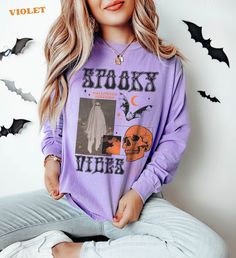 Thanks for checking out this Halloween 'Spooky Vibes' Shirt, with a cool collage vibe. It's the long Sleeve version of the Trendy Comfort Colors T-shirt. The graphic combines classic Halloween motifs laid out in the 90's and Y2K poster style.  For the Comfort Colors Long Sleeve Tshirt, The soft-washed, garment-dyed fabric has a weathered vintage look that hold up well, but soften over over time for a warm look. This fully customized tee is made 100% with ring-spun cotton. The double-needle stitc Spooky Halloween Tops, Grunge Long Sleeve Tops For Halloween, Horror Graphic Print Long Sleeve T-shirt, Halloween Horror Long Sleeve T-shirt, Horror Style Long Sleeve Tops For Streetwear, Halloween Witchy Streetwear Tops, Witchy Halloween Streetwear Tops, Witchy Tops For Halloween Streetwear, Witchy Streetwear Tops For Halloween