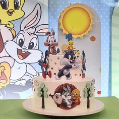 a birthday cake with cartoon characters on it