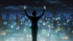 a person standing in front of a cityscape at night with their hands up