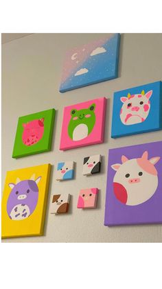 the wall is decorated with colorful paintings and magnets on it's sides, including farm animals