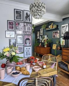 a dining room filled with lots of food and decor