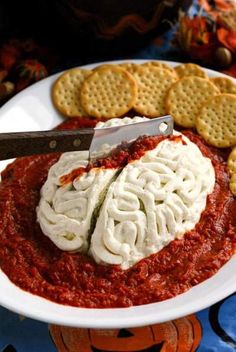 a white plate topped with cheese and crackers