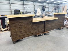 a large wooden counter sitting inside of a garage