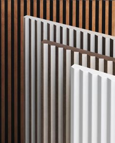 several white and brown radiators are lined up