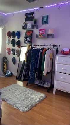 a room that has some clothes hanging on the wall and a rug in front of it