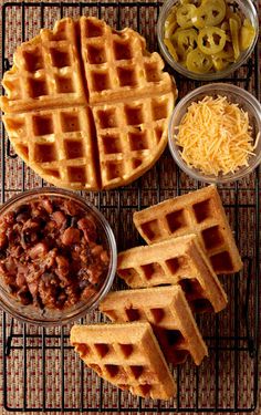 some waffles are on a cooling rack with other food items around them,