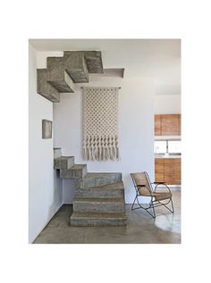 the stairs are made from concrete and have tassels hanging on it's sides