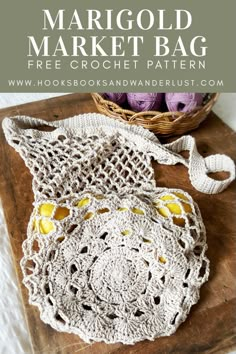 a crocheted bag sitting on top of a wooden table next to a basket