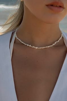 The perfect dainty pearl necklace to wear by itself, or to combine with your everyday necklace layering. 4mm-5mm Fresh water pearls Necklace length: 14.5” + 2" extension Spring ring closure at back Designed + handmade in Puerto Rico