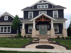 a house that is in the middle of some grass