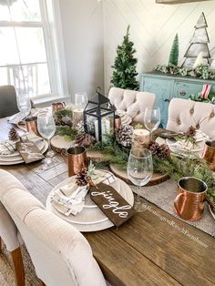 the table is set for christmas dinner