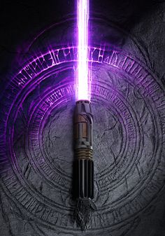 a purple light saber is glowing in the dark