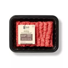 ground beef in a black container on a white background