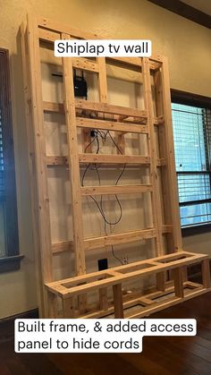 a wooden shelf sitting on top of a hard wood floor