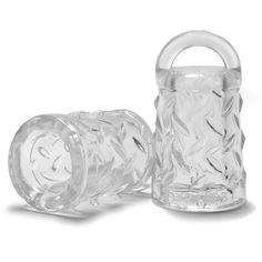 two clear glass vases sitting next to each other