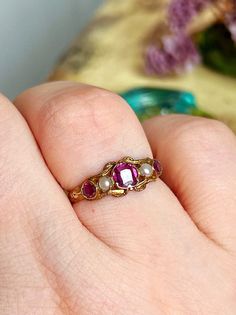 A delicate antique Victorian ring featuring 3 garnets and pearls. A beautiful vibrant pink shade makes this ring unique and perfect to brighten up your hands. DETAILS: Dimensions: 6.5US size - 1.23gr Hallmark: hallmarked for Birmingham 1864, 12ct gold Condition: Excellent All the items are carefully packaged with upcycled materials and ready to be gifted! Friendly layaway plans are always possible! Please DM for the details. You can message me in English, Italian or French! Thank you for visitin Antique Engagement Rings Unique, Antique Victorian Engagement Rings, Victorian Gold Jewelry, Antique Rings Gold, Vintage Promise Rings, Baroque Ring, Antique Engagement Rings Victorian, Victorian Wedding Ring, Victorian Engagement Ring