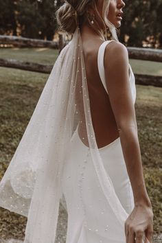 the back of a woman wearing a wedding veil