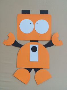 an orange robot cut out from construction paper