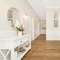 the inside of a house with white walls and wood floors is shown on instagram