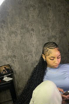 This fashionable hairstyle showcases an innovative and intricate pattern of cornrows on the scalp that seamlessly transitions into long, flowing box braids. The braids are skillfully crafted with precision, featuring a thickness that adds volume and texture, creating a striking contrast between the neat cornrows and - Click to see more of 38 Braided Hairstyles Inspired by Alicia Keys that are Taking Over the Trends and follow us for more hairstyle ideas. // Photo Credit: Instagram @bookedwitliz Alicia Keys Braids Hairstyles Fulani, Long Alicia Keys Braids, Long All Back Cornrows, Alyssa Keys Braids, Alicia Keys Cornrows Braids, Backline Hairstyle Braids, Thick Braid Hairstyles, Alicia Keys Fulani Braids, Wisdom Braids