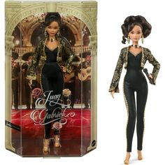 the doll is in its box and it has an image of a woman with black hair