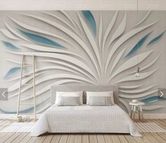 a bedroom with a large wall mural in the middle and a bed next to it