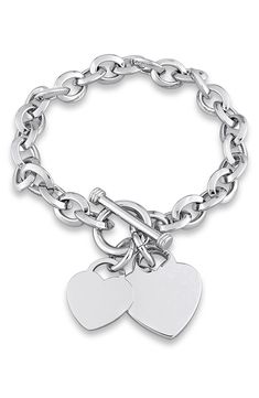 Double heart charms adorn an elegant oval-link bracelet finished in gleaming silvertone plate. Toggle clasp Brass/silvertone plate Imported Silver Bracelet Design For Women, Charm Bracelet Silver, Elegant Metal Heart Bracelet With Toggle Clasp, Silver Heart-shaped Bracelet With Charms, Heart-shaped Sterling Silver Charm Bracelet, Silver Heart-shaped Jewelry With Toggle Clasp, Silver Heart-shaped Bracelet With Toggle Clasp, Silver Bracelet Designs, Xoxo Jewelry