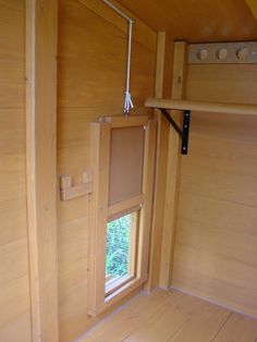 the inside of a tiny house with wooden walls