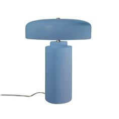 a light blue table lamp with a round shade on the base and a cord attached to it